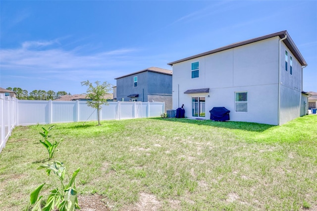 111 Rain Lily Ave, Spring Hill, FL 34609 - back of house with stucco siding