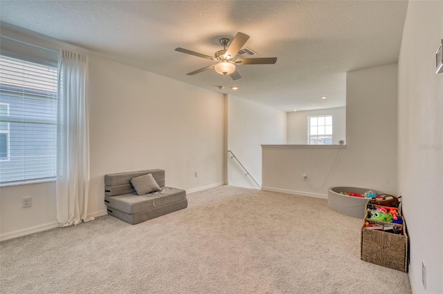 111 Rain Lily Ave, Spring Hill, FL 34609 - rec room with carpet flooring, a ceiling fan, and a textured ceiling