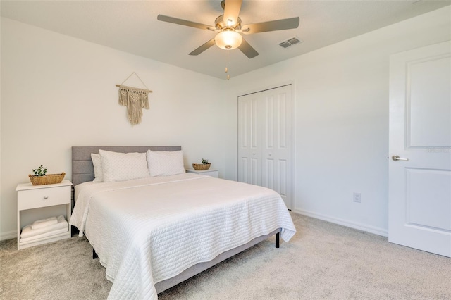 111 Rain Lily Ave, Spring Hill, FL 34609 - bedroom featuring light colored carpet, a closet, and a ceiling fan
