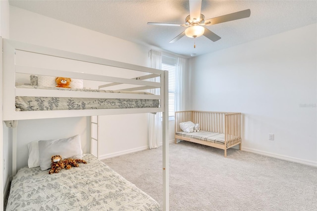 111 Rain Lily Ave, Spring Hill, FL 34609 - carpeted bedroom featuring a ceiling fan and a textured ceiling