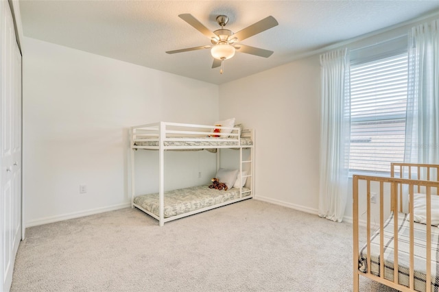 111 Rain Lily Ave, Spring Hill, FL 34609 - unfurnished bedroom with carpet, ceiling fan, and a nursery area