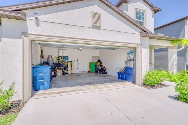 111 Rain Lily Ave, Spring Hill, FL 34609 - garage featuring driveway