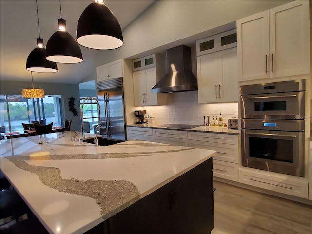 4216 Bur St, Port Charlotte, FL 33948 - kitchen featuring wall chimney exhaust hood, stainless steel appliances, decorative backsplash, lofted ceiling, and glass insert cabinets