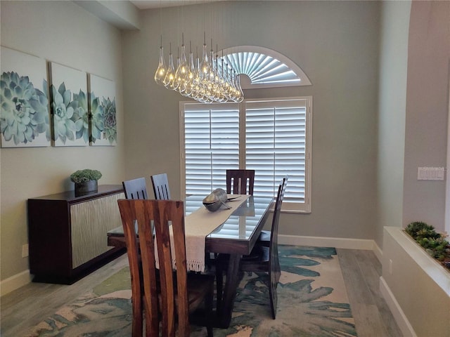 4216 Bur St, Port Charlotte, FL 33948 - dining space featuring light wood-style floors, a chandelier, and baseboards