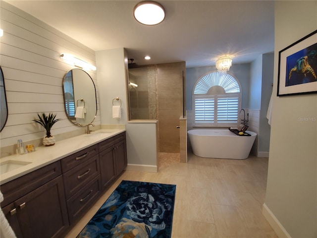 4216 Bur St, Port Charlotte, FL 33948 - full bath featuring a walk in shower, double vanity, a freestanding bath, and a chandelier