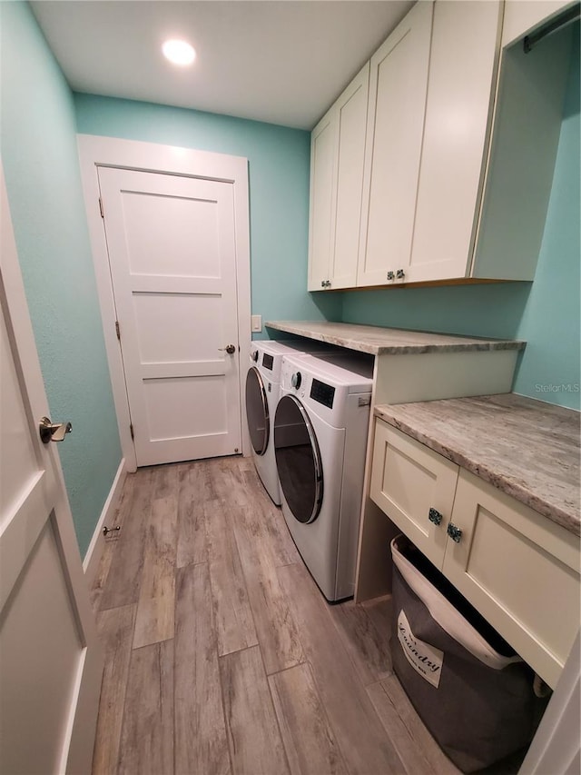 4216 Bur St, Port Charlotte, FL 33948 - laundry area with cabinet space, washing machine and dryer, light wood-style floors, and recessed lighting