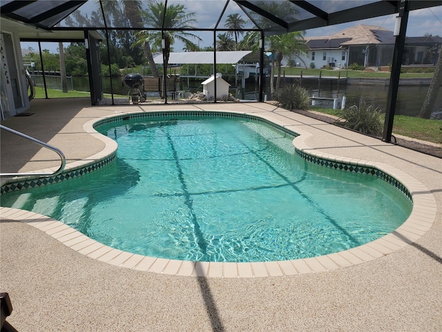 4216 Bur St, Port Charlotte, FL 33948 - swimming pool featuring a patio area, a lanai, and a water view