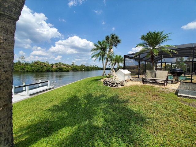 4216 Bur St, Port Charlotte, FL 33948 - view of grassy yard featuring a water view, a boat dock, and a lanai