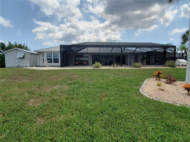 4216 Bur St, Port Charlotte, FL 33948 - rear view of house with a lawn and glass enclosure