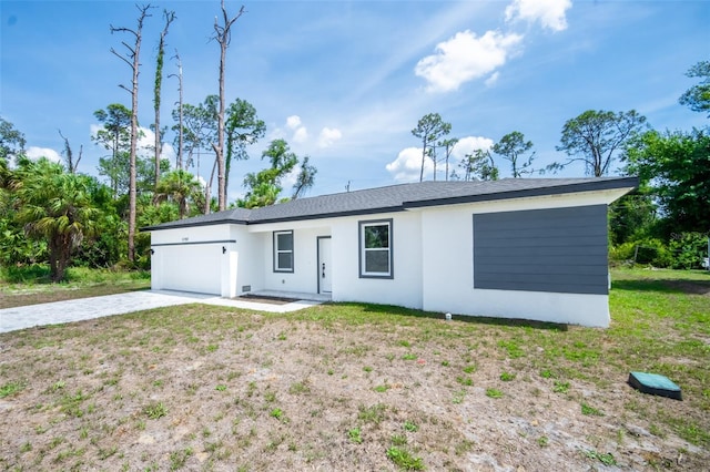 17197 Russell Ave, Port Charlotte, FL 33954 - ranch-style home with an attached garage, stucco siding, driveway, and a front yard
