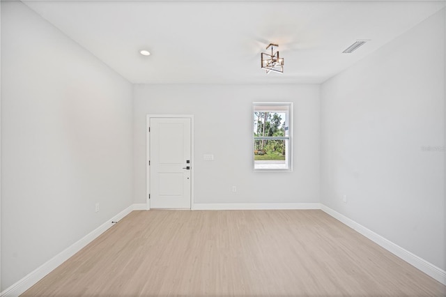 17197 Russell Ave, Port Charlotte, FL 33954 - unfurnished room with light wood-style floors, baseboards, a chandelier, and recessed lighting