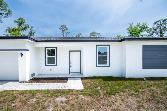 17197 Russell Ave, Port Charlotte, FL 33954 - ranch-style house featuring an attached garage and stucco siding