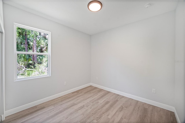 16218 Chamberlain Blvd, Port Charlotte, FL 33954 - spare room featuring light wood-type flooring, plenty of natural light, and baseboards