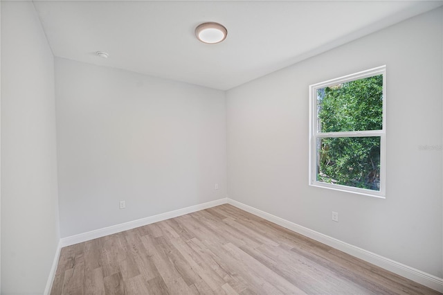 16218 Chamberlain Blvd, Port Charlotte, FL 33954 - unfurnished room with light wood-style floors and baseboards