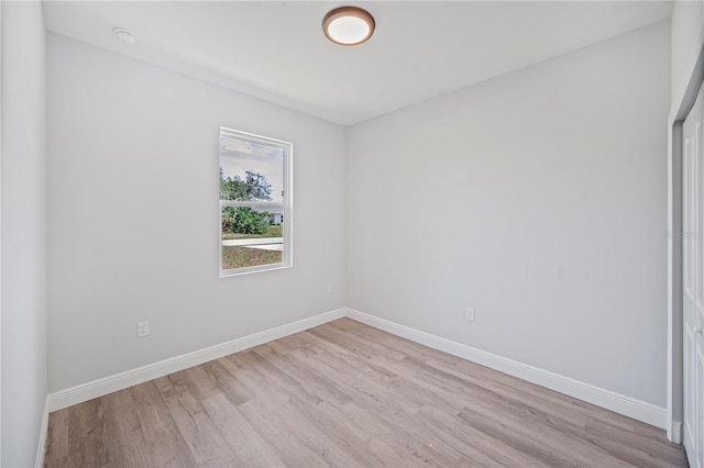 16218 Chamberlain Blvd, Port Charlotte, FL 33954 - spare room featuring light wood-style flooring, baseboards, and a smoke detector