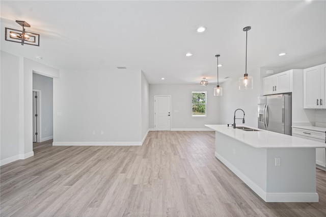 16218 Chamberlain Blvd, Port Charlotte, FL 33954 - kitchen with a sink, stainless steel fridge, light countertops, light wood-style floors, and recessed lighting