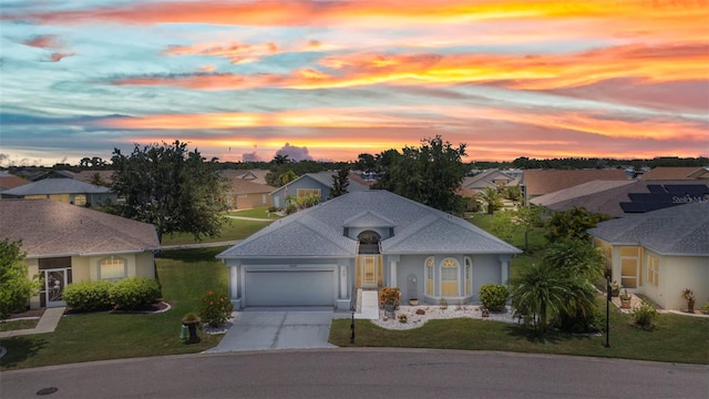 24312 Westgate Blvd, Port Charlotte, FL 33980 - view of front facade with a residential view, an attached garage, concrete driveway, a yard, and stucco siding