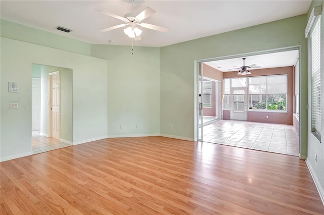 10263 Shadow Run Cir, Punta Gorda, FL 33955 - spare room featuring light wood-style floors, a ceiling fan, and baseboards