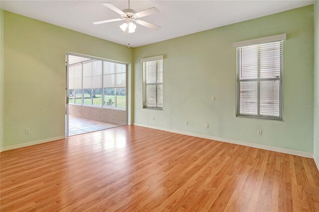10263 Shadow Run Cir, Punta Gorda, FL 33955 - spare room with light wood-style flooring, a ceiling fan, and baseboards