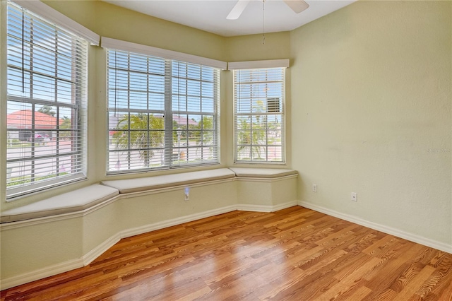 10263 Shadow Run Cir, Punta Gorda, FL 33955 - unfurnished room with wood finished floors, healthy amount of natural light, and baseboards