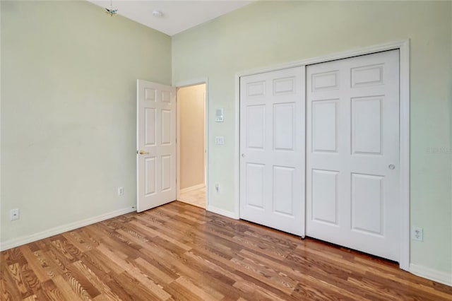 10263 Shadow Run Cir, Punta Gorda, FL 33955 - unfurnished bedroom with wood finished floors, baseboards, and a closet