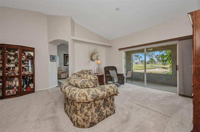 1876 Birmingham Blvd, Punta Gorda, FL 33980 - sitting room featuring carpet, arched walkways, and lofted ceiling