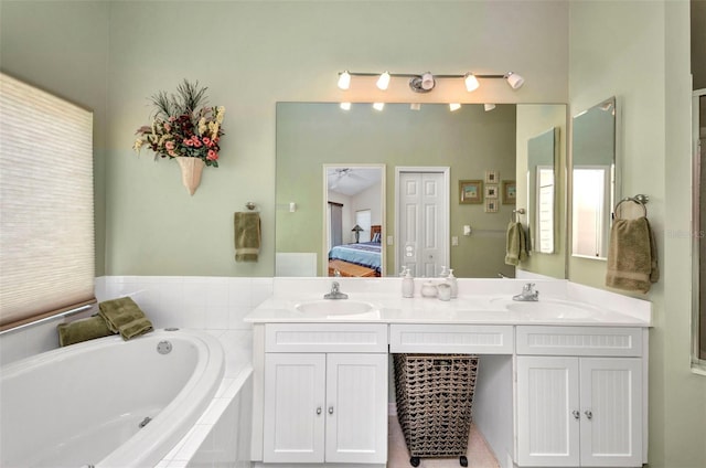1876 Birmingham Blvd, Punta Gorda, FL 33980 - bathroom featuring a garden tub, double vanity, and connected bathroom