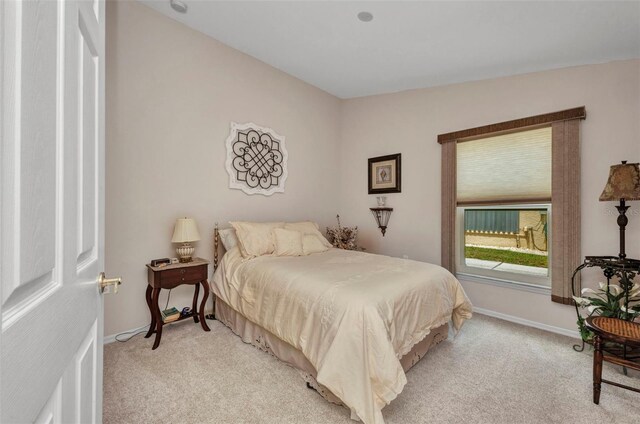 1876 Birmingham Blvd, Punta Gorda, FL 33980 - bedroom featuring light carpet and baseboards