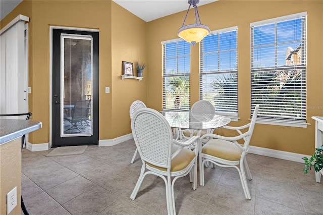 99 Vivante Blvd Unit 310, Punta Gorda, FL 33950 - dining space featuring baseboards and light tile patterned floors