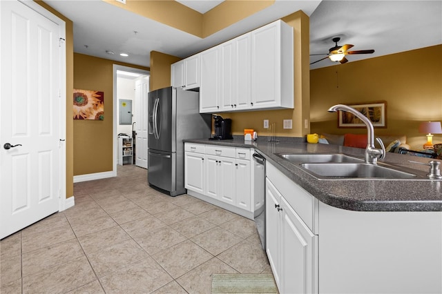 99 Vivante Blvd Unit 310, Punta Gorda, FL 33950 - kitchen featuring stainless steel appliances, a sink, dark countertops, white cabinets, and recessed lighting