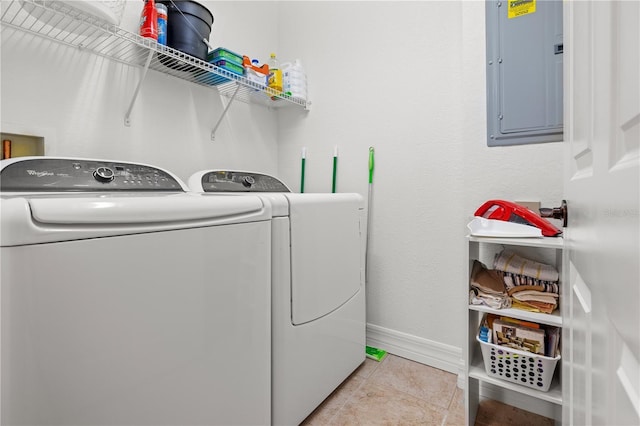 99 Vivante Blvd Unit 310, Punta Gorda, FL 33950 - laundry area with electric panel, washing machine and clothes dryer, baseboards, and light tile patterned floors