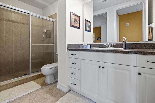 99 Vivante Blvd Unit 310, Punta Gorda, FL 33950 - full bathroom featuring toilet, vanity, a stall shower, and tile patterned floors