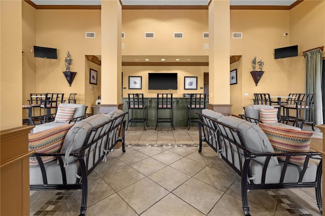 99 Vivante Blvd Unit 310, Punta Gorda, FL 33950 - tiled living room with a towering ceiling and crown molding