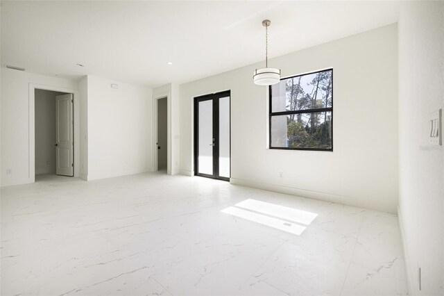 355 Milton St, Port Charlotte, FL 33954 - empty room with light marble finish floors and french doors