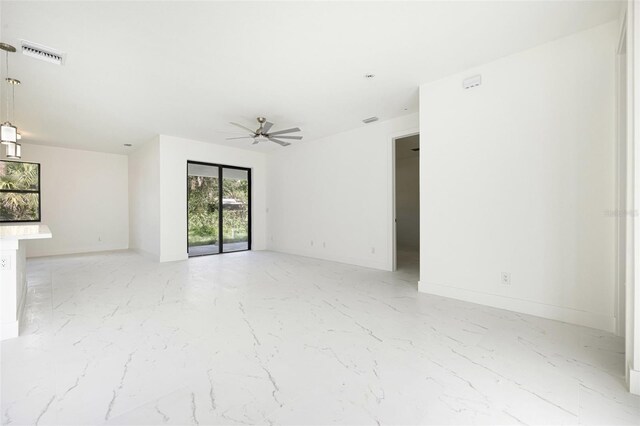 355 Milton St, Port Charlotte, FL 33954 - spare room featuring light marble finish flooring and a ceiling fan