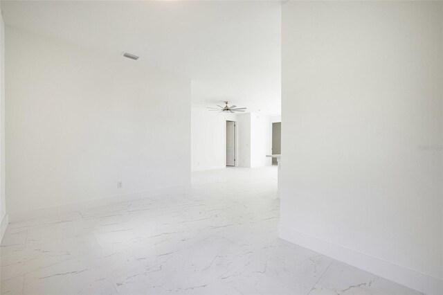 355 Milton St, Port Charlotte, FL 33954 - hall featuring light marble finish floors and baseboards