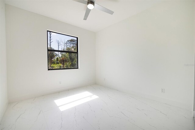 355 Milton St, Port Charlotte, FL 33954 - unfurnished room with marble look tile flooring, a ceiling fan, and baseboards