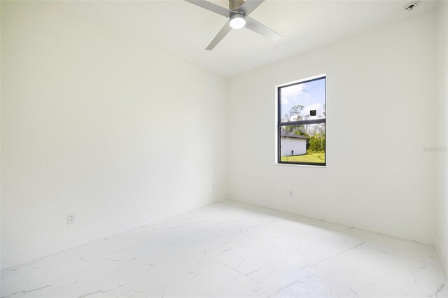 355 Milton St, Port Charlotte, FL 33954 - unfurnished room featuring light marble finish flooring, a ceiling fan, and baseboards