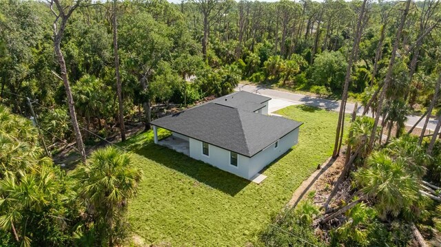 355 Milton St, Port Charlotte, FL 33954 - view from above of property with a heavily wooded area