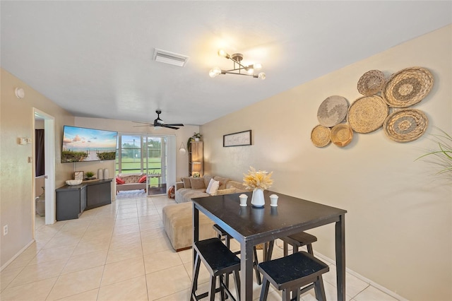 12538 SW Kingsway Cir Unit 1503, Lake Suzy, FL 34269 - dining space featuring light tile patterned floors, a ceiling fan, and baseboards