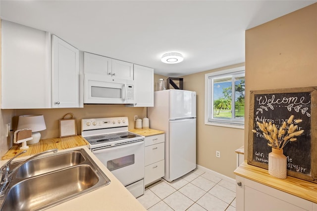 12538 SW Kingsway Cir Unit 1503, Lake Suzy, FL 34269 - kitchen featuring white appliances, a sink, white cabinetry, and light tile patterned floors