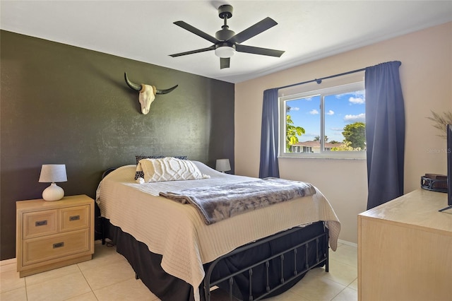 12538 SW Kingsway Cir Unit 1503, Lake Suzy, FL 34269 - bedroom featuring light tile patterned floors, a ceiling fan, and baseboards