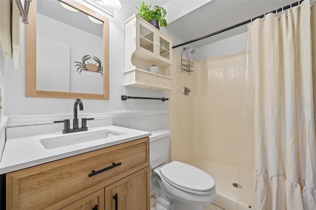 12538 SW Kingsway Cir Unit 1503, Lake Suzy, FL 34269 - full bathroom with toilet, a wainscoted wall, vanity, and curtained shower