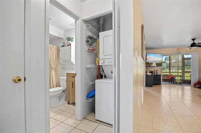 12538 SW Kingsway Cir Unit 1503, Lake Suzy, FL 34269 - washroom with stacked washer / drying machine, light tile patterned floors, and a ceiling fan