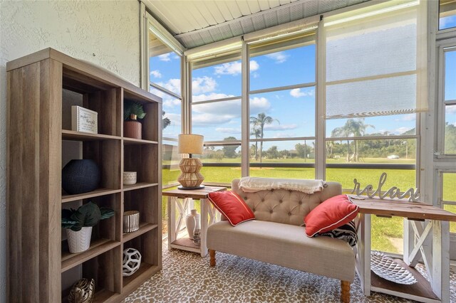 12538 SW Kingsway Cir Unit 1503, Lake Suzy, FL 34269 - sunroom featuring plenty of natural light, carpet floors, and a textured wall