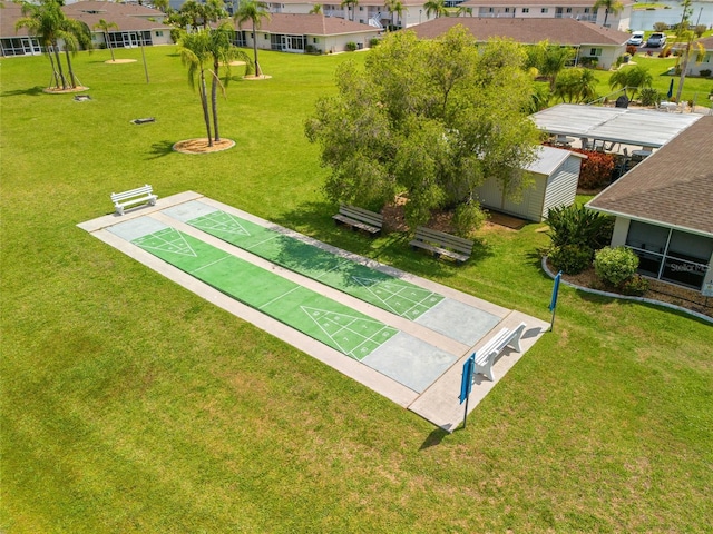 12538 SW Kingsway Cir Unit 1503, Lake Suzy, FL 34269 - view of community with shuffleboard, a residential view, and a lawn