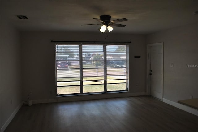21275 Austin Ave, Port Charlotte, FL 33952 - unfurnished room featuring wood finished floors, ceiling fan, and baseboards
