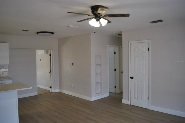 21275 Austin Ave, Port Charlotte, FL 33952 - unfurnished room with a ceiling fan, wood finished floors, and baseboards