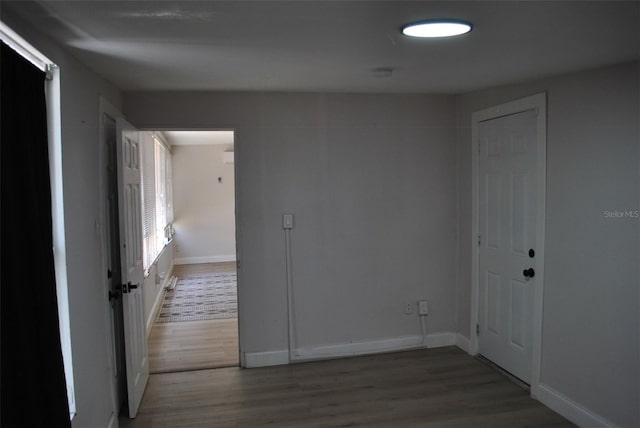 21275 Austin Ave, Port Charlotte, FL 33952 - empty room with wood finished floors and baseboards