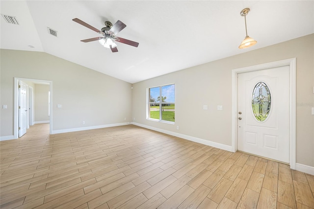 11615 SW Pine Ave, Arcadia, FL 34269 - foyer entrance with a ceiling fan, vaulted ceiling, baseboards, and light wood-style flooring